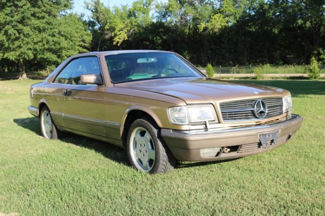 1986 Gold Mercedes-Benz 500-Series Coupe