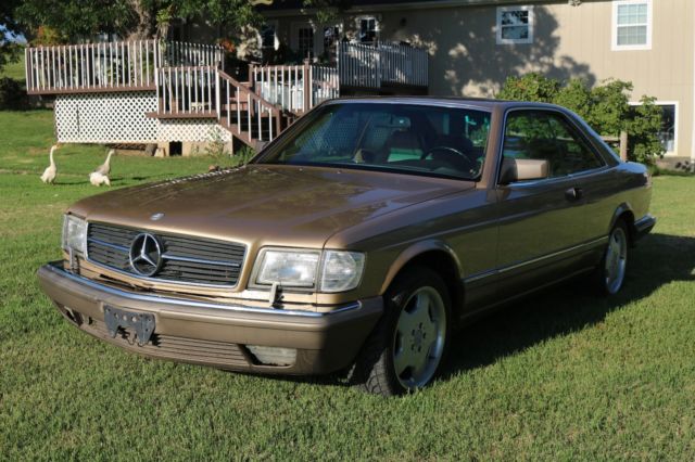 1986 Gold Mercedes-Benz 500-Series Coupe