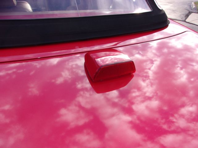 1986 torch red Mercedes-Benz SL-Class convertible