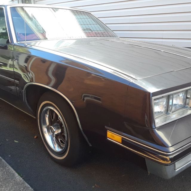 1986 Burgundy Oldsmobile Cutlass Coupe