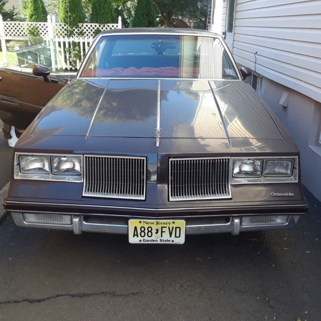 1986 Burgundy Oldsmobile Cutlass Coupe
