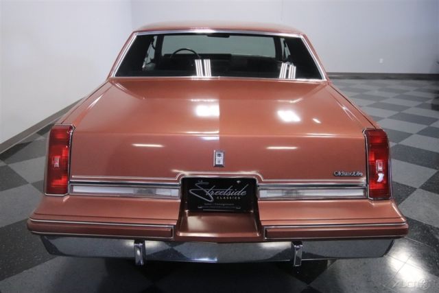 1986 Red Oldsmobile Cutlass