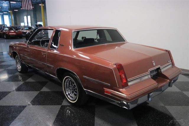 1986 Red Oldsmobile Cutlass