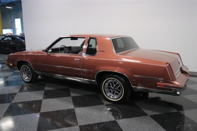 1986 Red Oldsmobile Cutlass