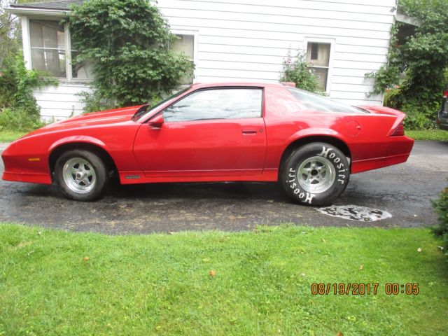 1986 red Chevrolet Camaro Coupe