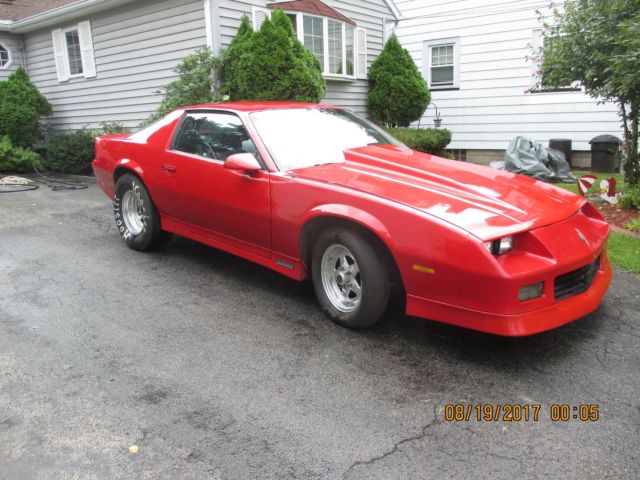 1986 red Chevrolet Camaro Coupe