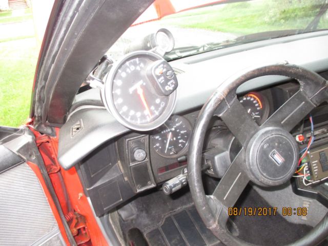 1986 red Chevrolet Camaro Coupe