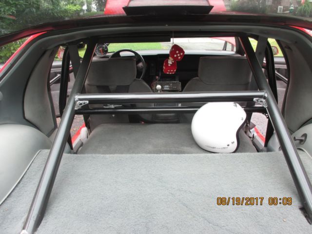 1986 red Chevrolet Camaro Coupe