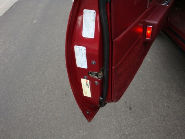 1987 Burgundy Cadillac DeVille Coupe