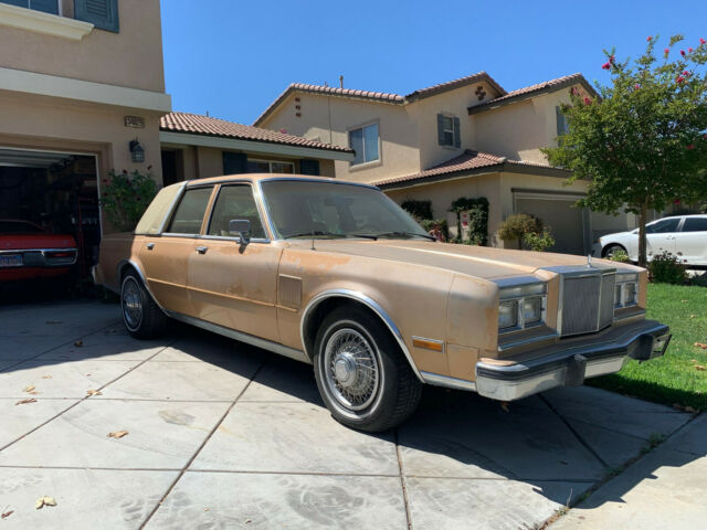 1987 Gold Chrysler 5th Avenue Sedan