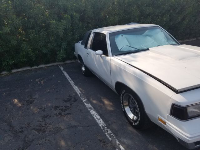 1987 Red Oldsmobile Cutlass Coupe