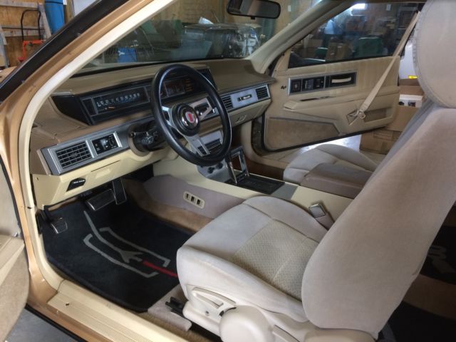1987 Gold and black Oldsmobile Eighty-Eight Coupe