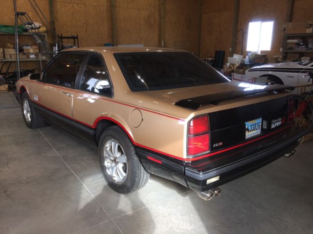 1987 Gold and black Oldsmobile Eighty-Eight Coupe