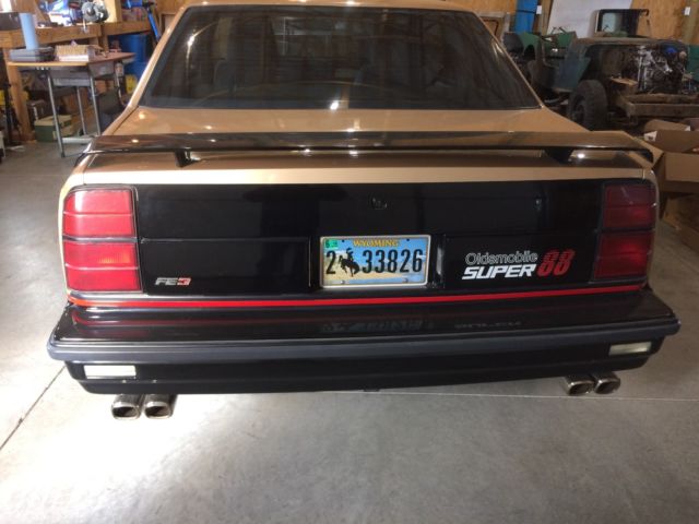 1987 Gold and black Oldsmobile Eighty-Eight Coupe