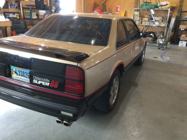 1987 Gold and black Oldsmobile Eighty-Eight Coupe