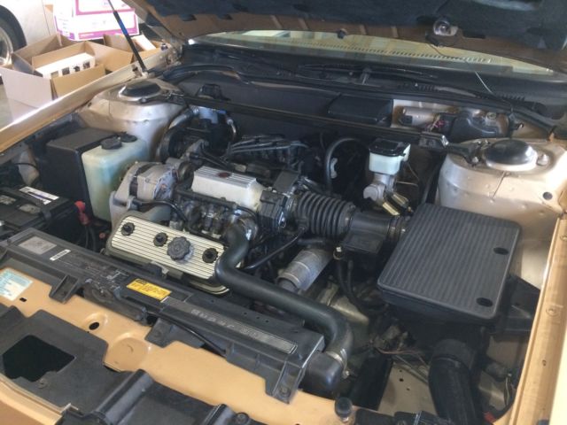 1987 Gold and black Oldsmobile Eighty-Eight Coupe