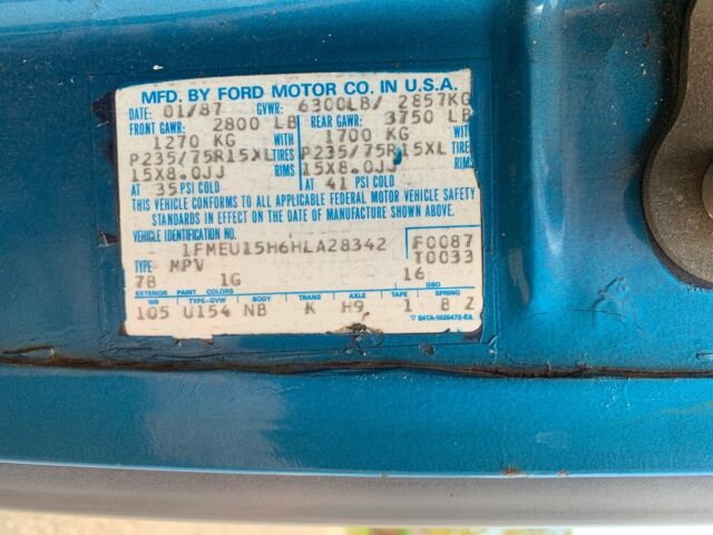 1987 Blue Ford Bronco Standard Passenger Van