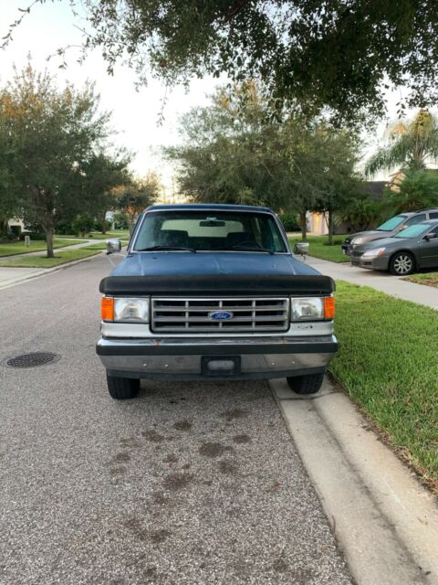 1987 Blue Ford Bronco Standard Passenger Van