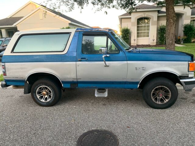 1987 Blue Ford Bronco Standard Passenger Van