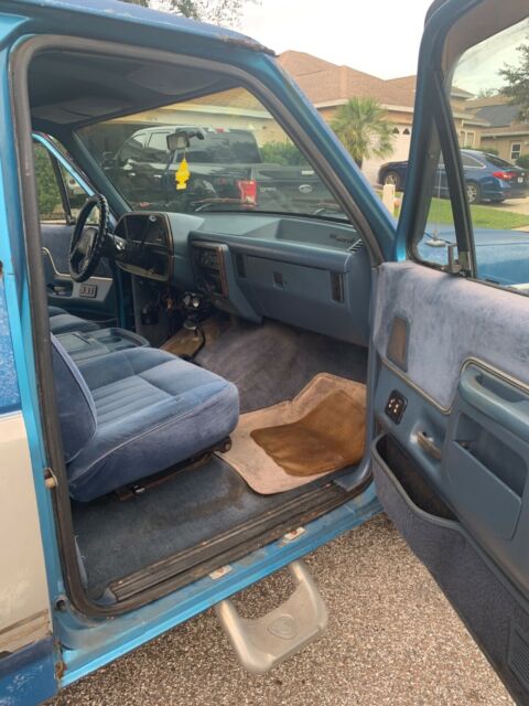 1987 Blue Ford Bronco Standard Passenger Van