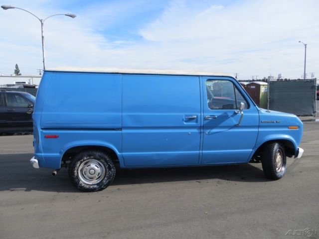 1987 Blue Ford E-Series Van