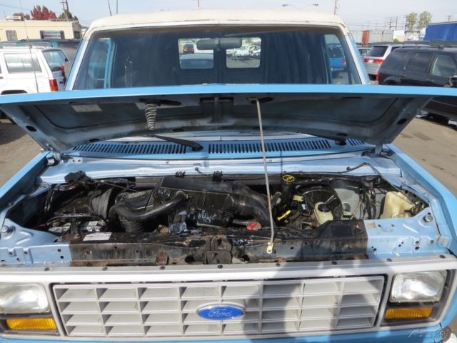 1987 Blue Ford E-Series Van