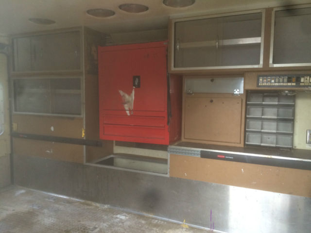 1987 red and white Ford E-Series Van full size fire ambulance ( retired)