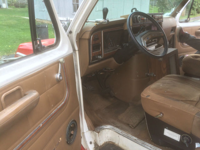 1987 red and white Ford E-Series Van full size fire ambulance ( retired)
