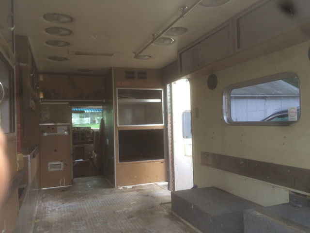 1987 red and white Ford E-Series Van full size fire ambulance ( retired)