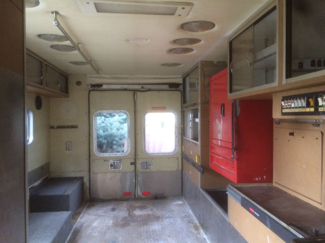 1987 red and white Ford E-Series Van full size fire ambulance ( retired)