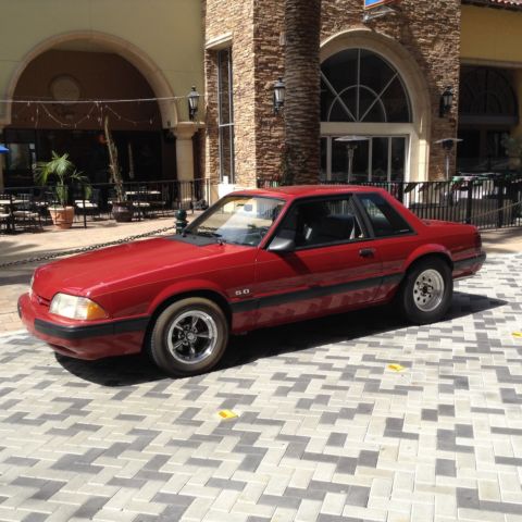 1987 Red Ford Mustang Sedan