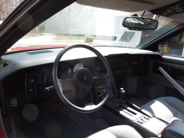 1987 red Chevrolet Camaro Coupe
