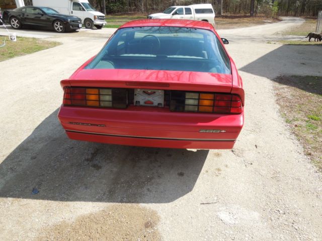 1987 red Chevrolet Camaro Coupe