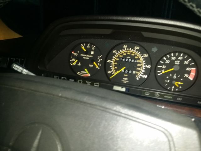 1987 gunstock grey/gold trim Mercedes-Benz 500-Series Sedan