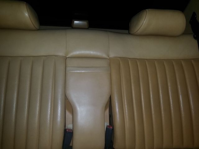 1987 gunstock grey/gold trim Mercedes-Benz 500-Series Sedan