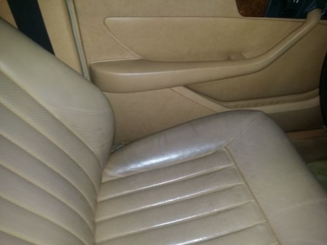 1987 gunstock grey/gold trim Mercedes-Benz 500-Series Sedan