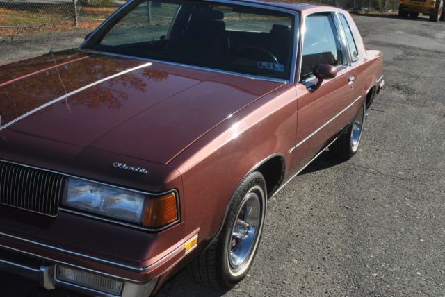 1987 White Oldsmobile Cutlass Sedan