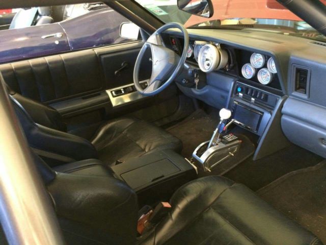 1987 Burgundy Chrysler LeBaron Coupe