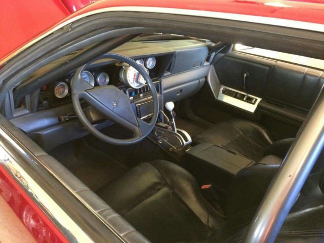 1987 Burgundy Chrysler LeBaron Coupe