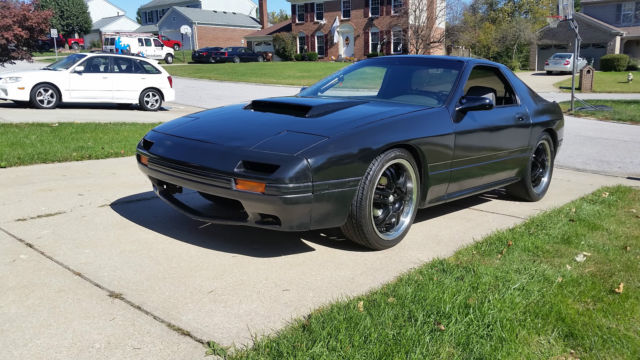1987 black Mazda RX-7 2 door coupe