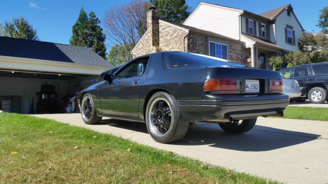1987 black Mazda RX-7 2 door coupe
