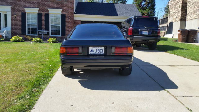 1987 black Mazda RX-7 2 door coupe
