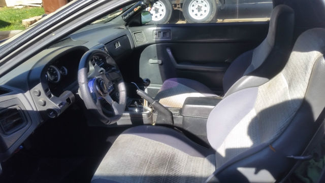 1987 black Mazda RX-7 2 door coupe