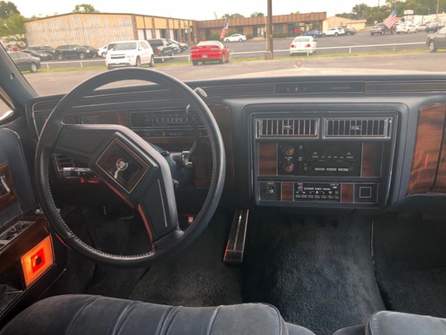 1988 White Cadillac Brougham Sedan