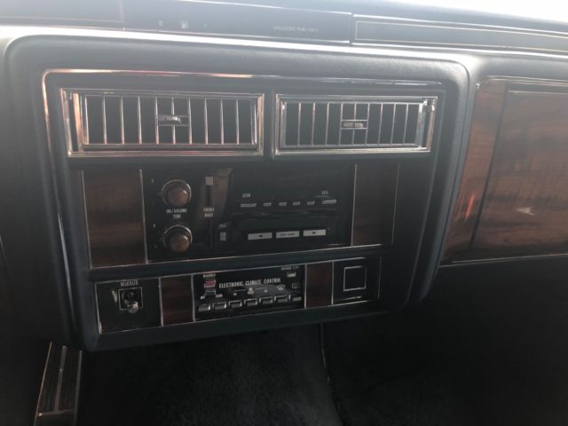 1988 White Cadillac Brougham Sedan