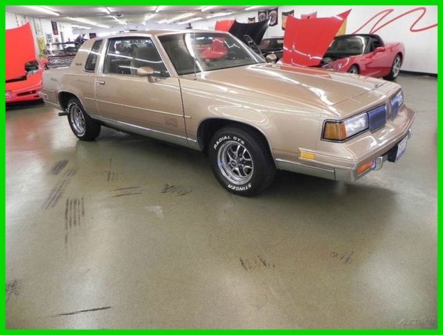 1988 Brown Oldsmobile Cutlass Coupe
