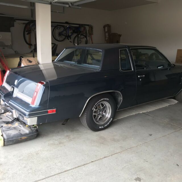 1988 blue Oldsmobile Cutlass Coupe