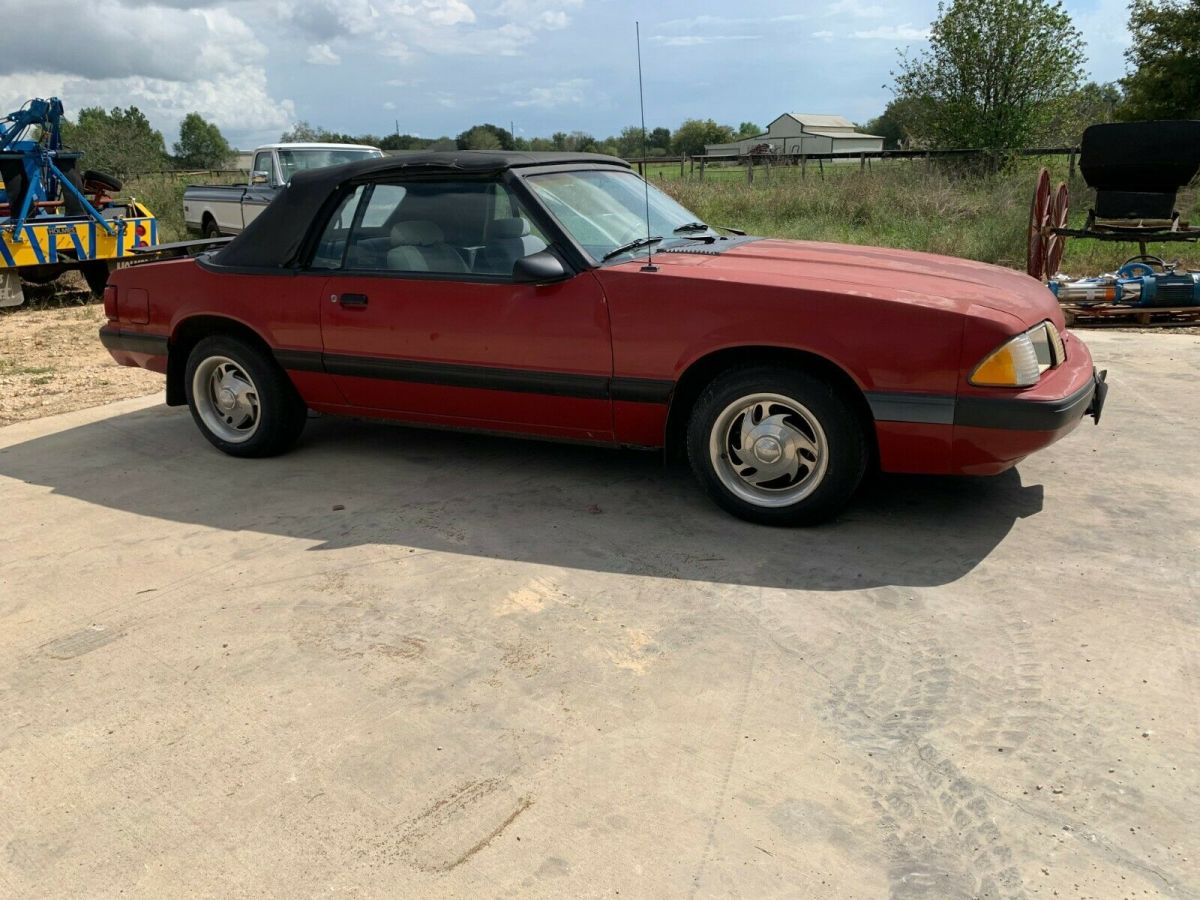 1988 red Ford Mustang Convertible