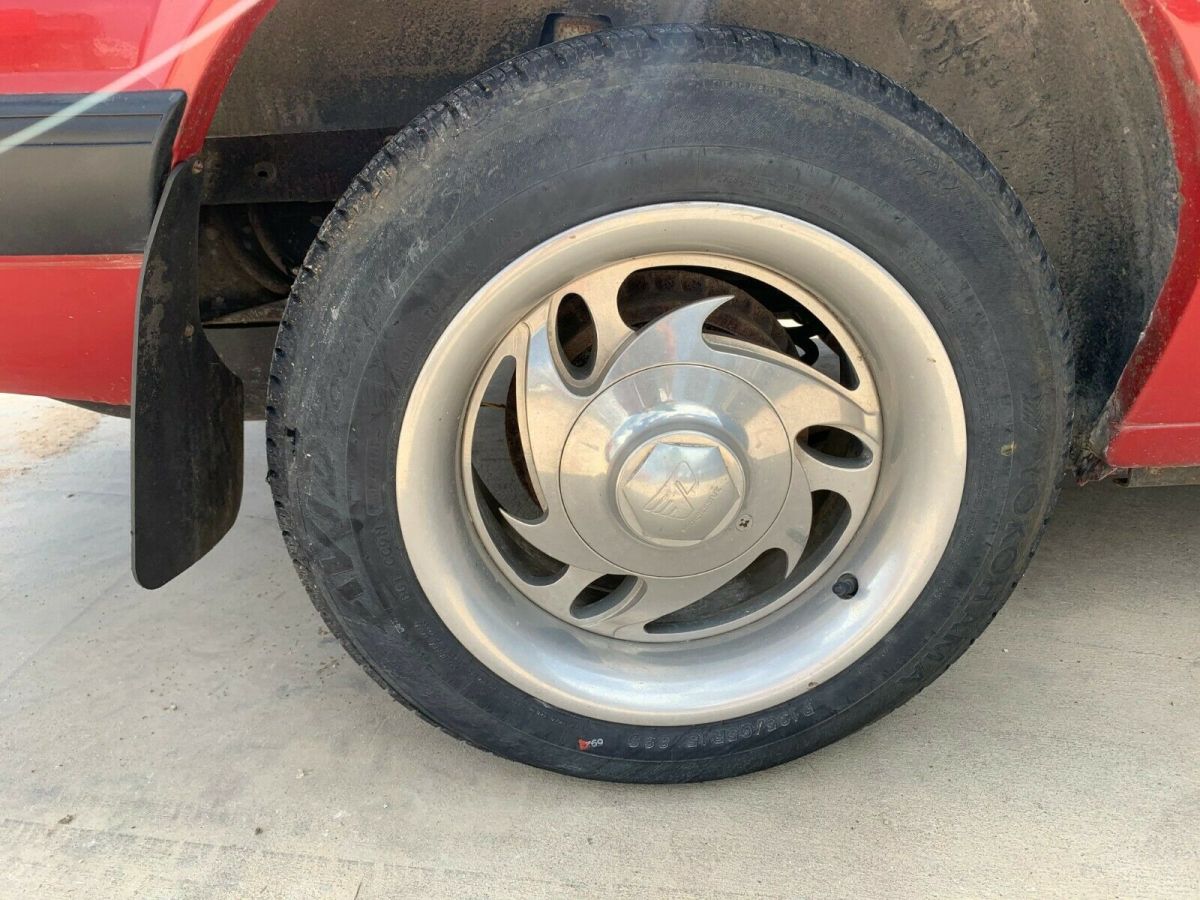 1988 red Ford Mustang Convertible