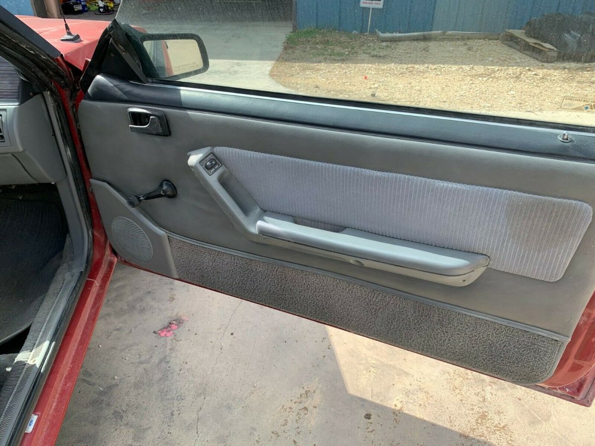 1988 red Ford Mustang Convertible